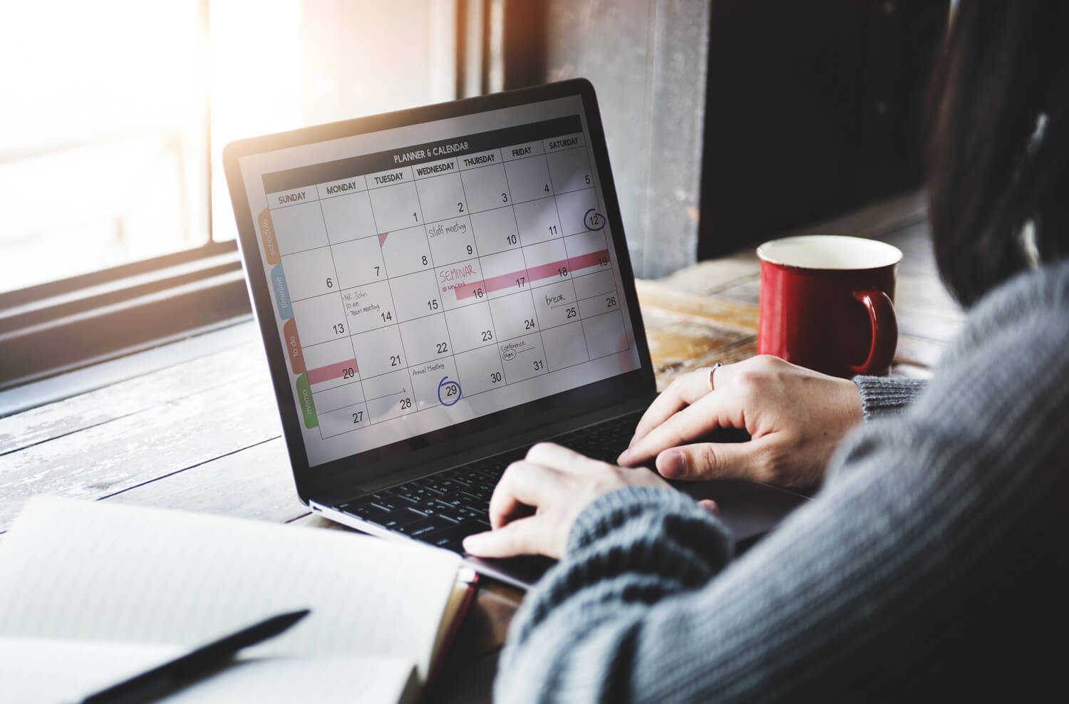 Your Calendar Holds the Key to Growth - woman looking at monthly calendar