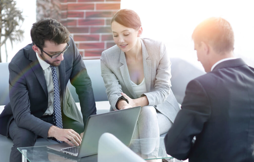 A couple meeting with an advisor to create a financial plan.