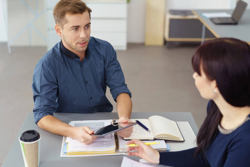 A financial advisor having a difficult conversation with a client.